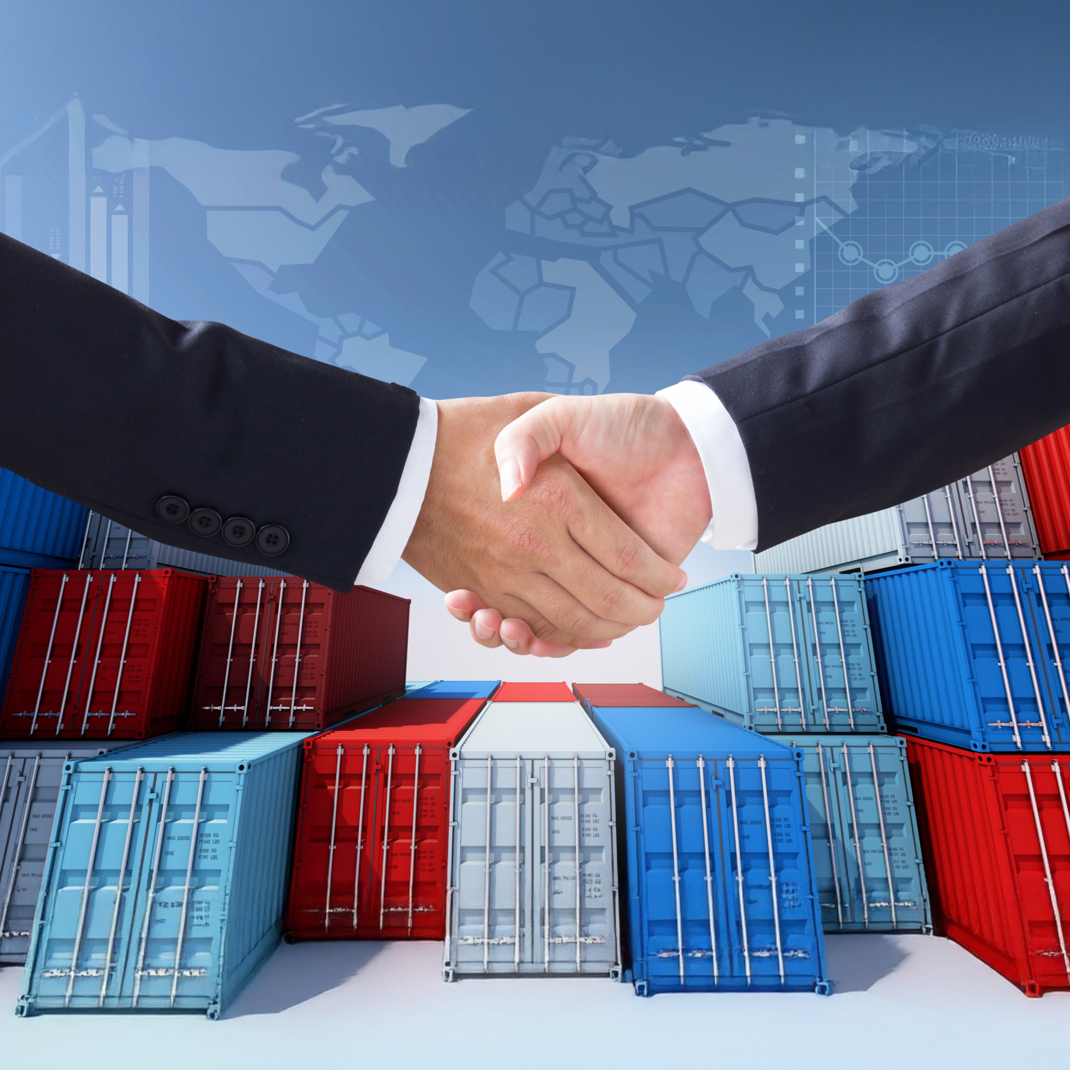 Business professionals shaking hands in front of stacked shipping containers, symbolizing partnership and collaboration in global freight forwarding and logistics.